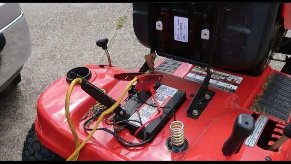 (image of jumper cables connected to lawn mower battery)